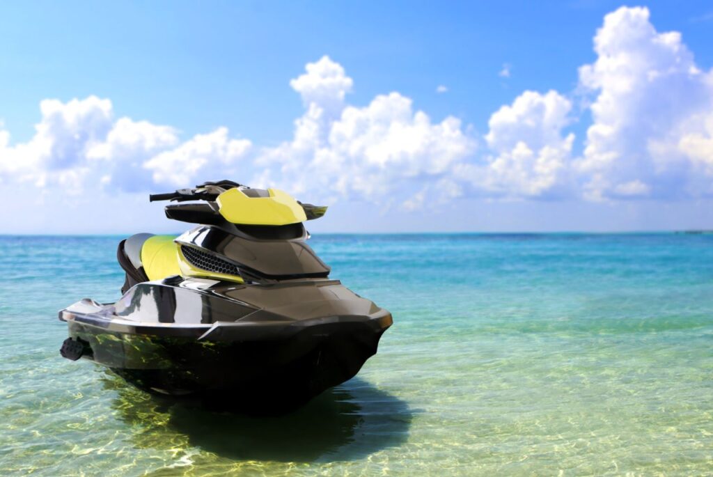 A jet ski is sitting in the water near a blue sky in Fort Lauderdale.